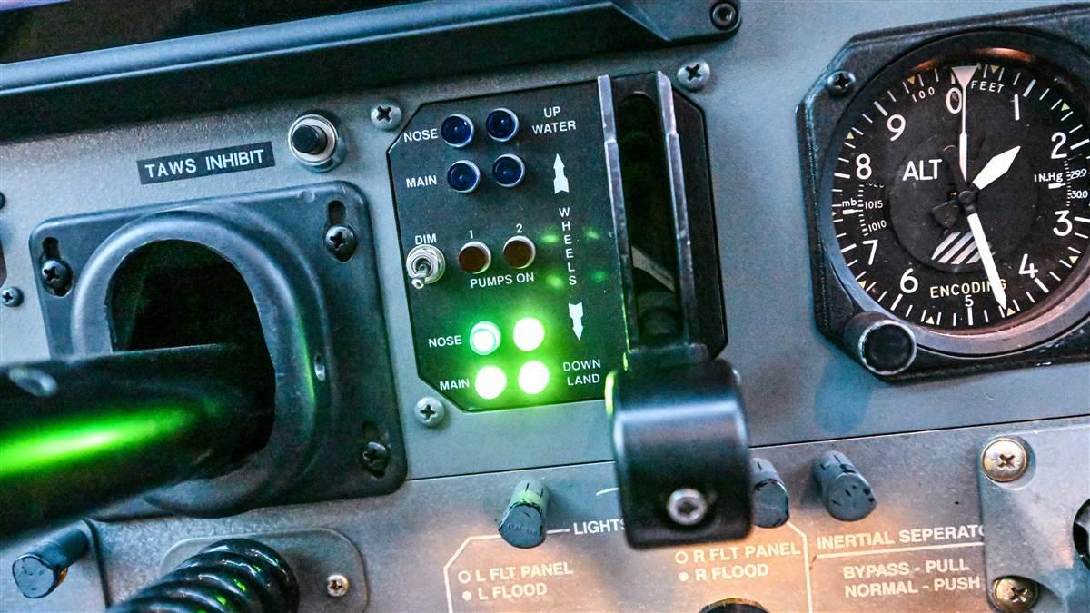 Wipaire's landing gear advisory system shows four green lights when the wheels are down, four blue lights when they're up, and two red lights when they're in transition, and it backs up the changes with aural callouts. Note the one-button TAWS Inhibit function meant to avoid nuisance terrain warnings when flying on and off the water.