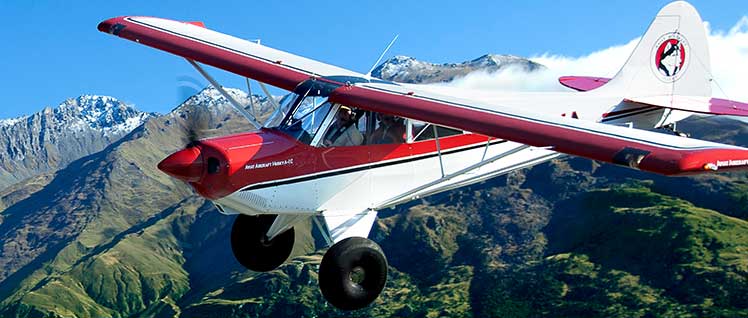AOPA Air Safety Institute Backcountry Resource Center: Husky Aircraft Flying Over Mountain
