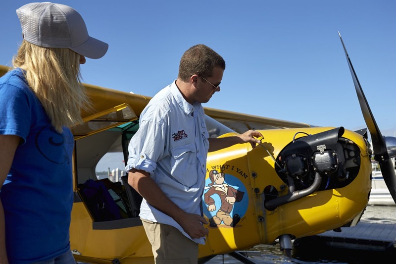 Photography of an instructor and student training with a Piper Cub on floats. Rob and Meghan Galloway.Tavares Seaplane Base (FA1)Tavares, FL USA