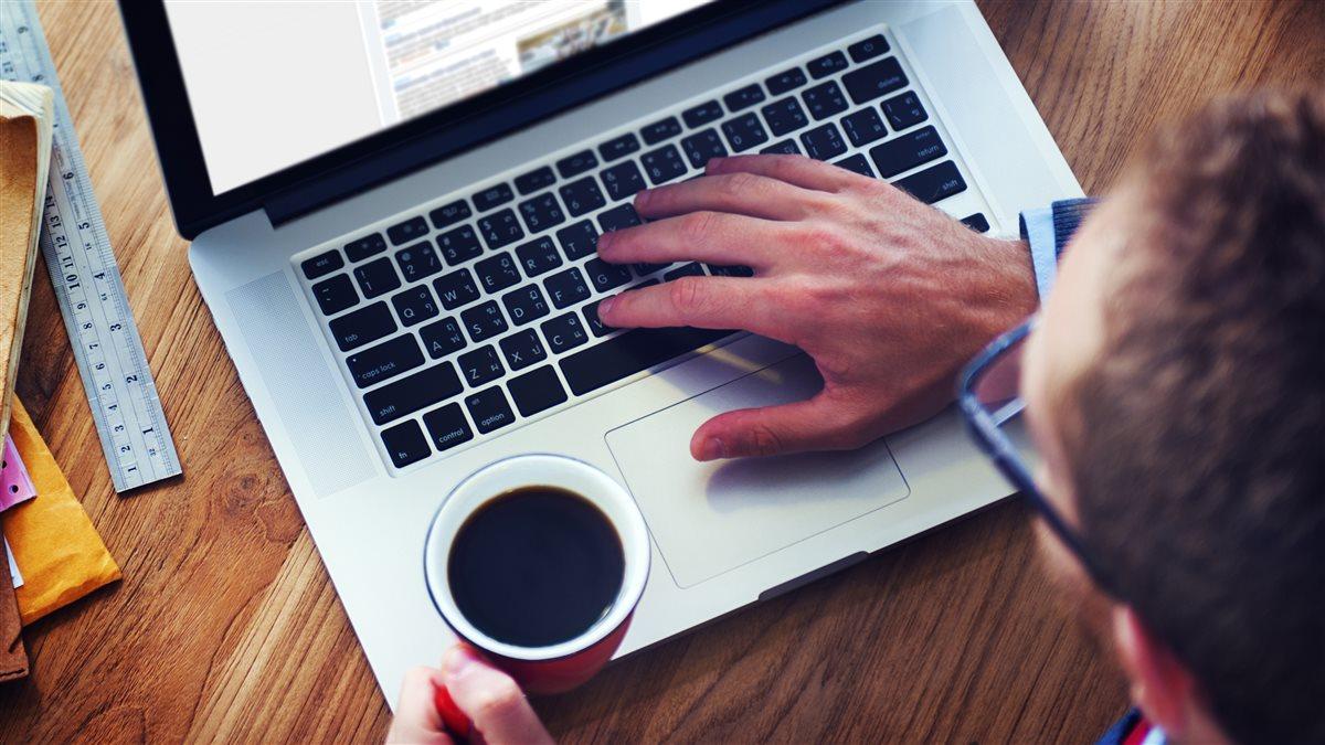 Man Using Laptop in the Office