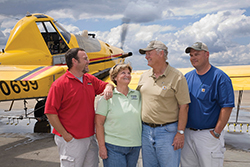 Stokes Flying Service is a family business with son Greg (far left), wife Lou, Dennie Stokes, and son Tracey playing vital roles.