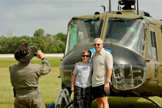 Andrew and Michael Megler have their photo taken after flying in the Huey.