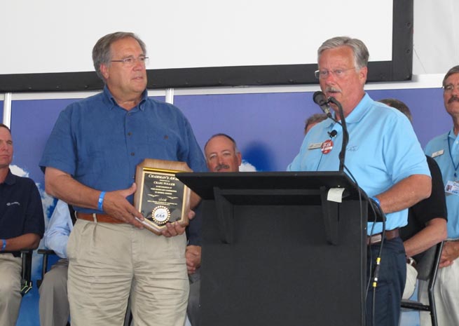 EAA Chairman Jack Pelton presented AOPA President Craig Fuller with the EAA Chairman's Award during the Stronger Together forum.