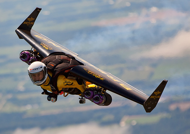 Yves Rossy flying over EAA AirVenture. Mike Shore photo, courtesy Breitling