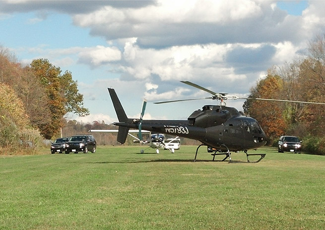 A black helicopter, FBI, and police vehicles set up for a television shoot at Warwick Municipal Airport in Warwick, N.Y. Oct. 24. Photo courtesy of Frank Galella III.