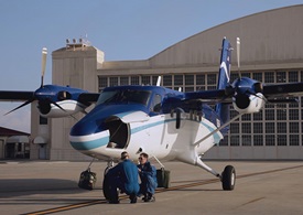 A NOAA flight crew prepares for a Twin Otter mission.