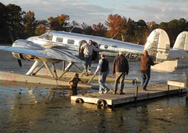 It takes a village to prep a Beech 18 on straight floats for flights. In Guntersville, AL, airport manager Matt Metcalfe wades in to help position the airplane after fueling.