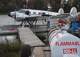 A fuel dolly makes for quick fueling of seaplanes at the dock just off the runway at Joe Starnes Field in Guntersville, AL.