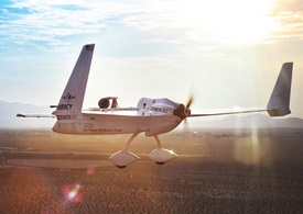 The Long-ESA, a modified Long-EZ running on battery powered, in flight. Photo courtesy of Yates Electrospace Corp.