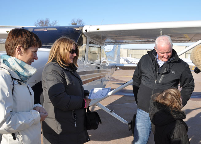 After the flight, Harbin discussed hearing “Echo” in the aircraft’s N number on the radio, and learned a bit about the phonetic alphabet. Left to right: Mireille Goyer, Women of Aviation Worldwide Week founder; Susan Gray; AOPA President Mark Baker; Esther Harbin.