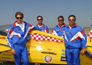 Mike Mangold, far right, was a member of the 2001 U.S. Unlimited Aerobatic Team, and also qualified for the 2003 team. (International competitions are held every two years). Photo courtesy of Mike Heuer/International Aerobatic Club. 