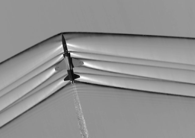 This schlieren image reveals the shock wave of a supersonic jet flying over the Mojave Desert. Researchers used NASA-developed image processing software to remove the desert background, then combined and averaged multiple frames to produce a clear picture of the shock waves. NASA photo.