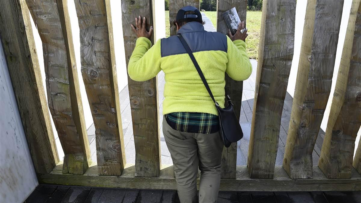 A visitor to the Flight 93 National Memorial is overwhelmed by emotion near the debris field of the United Airlines flight