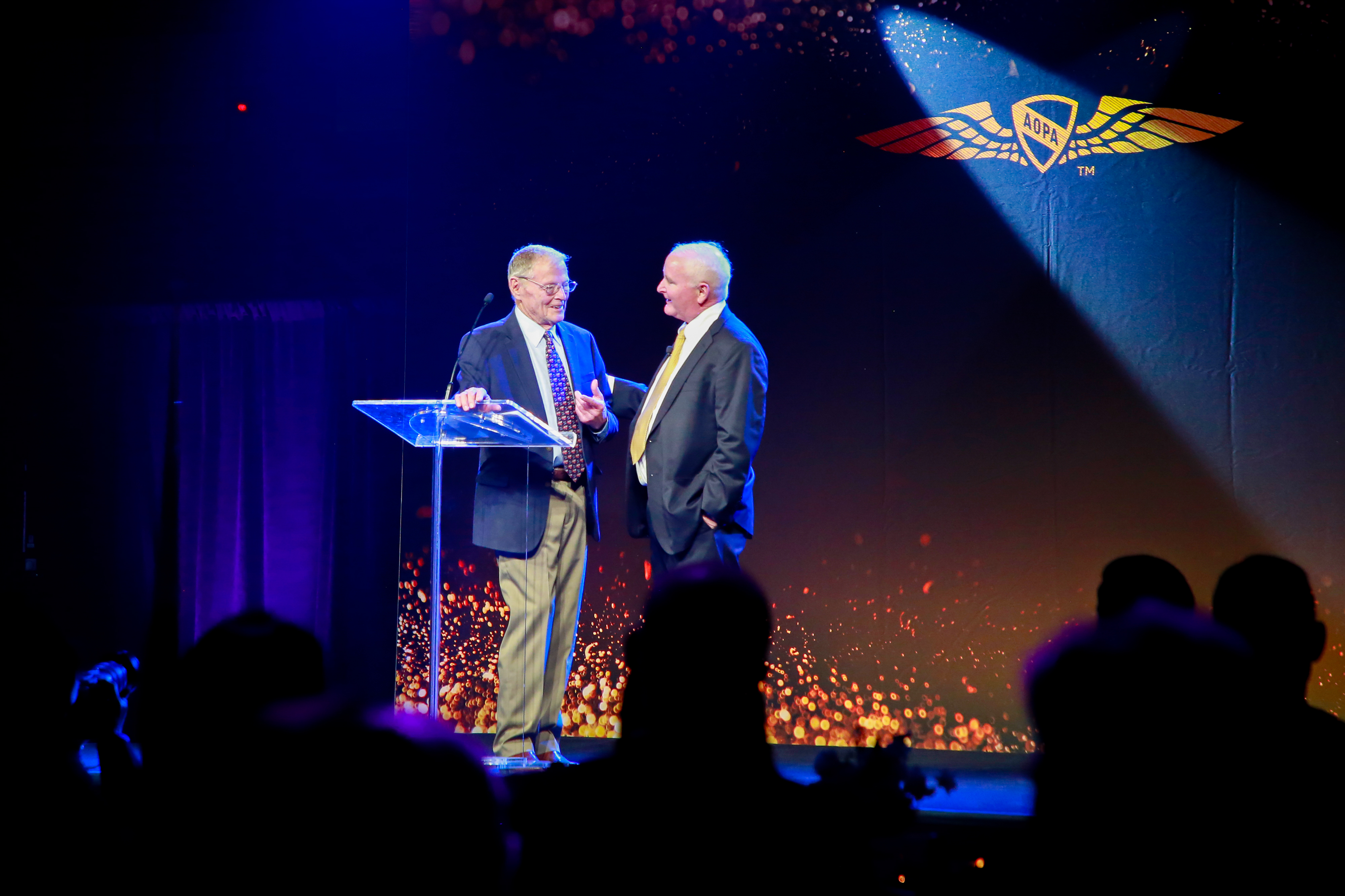 AOPA President Mark Baker presents retired Sen. James Inhofe with the R.A. 'Bob' Hoover Trophy.  Photo by Rebecca Boone.