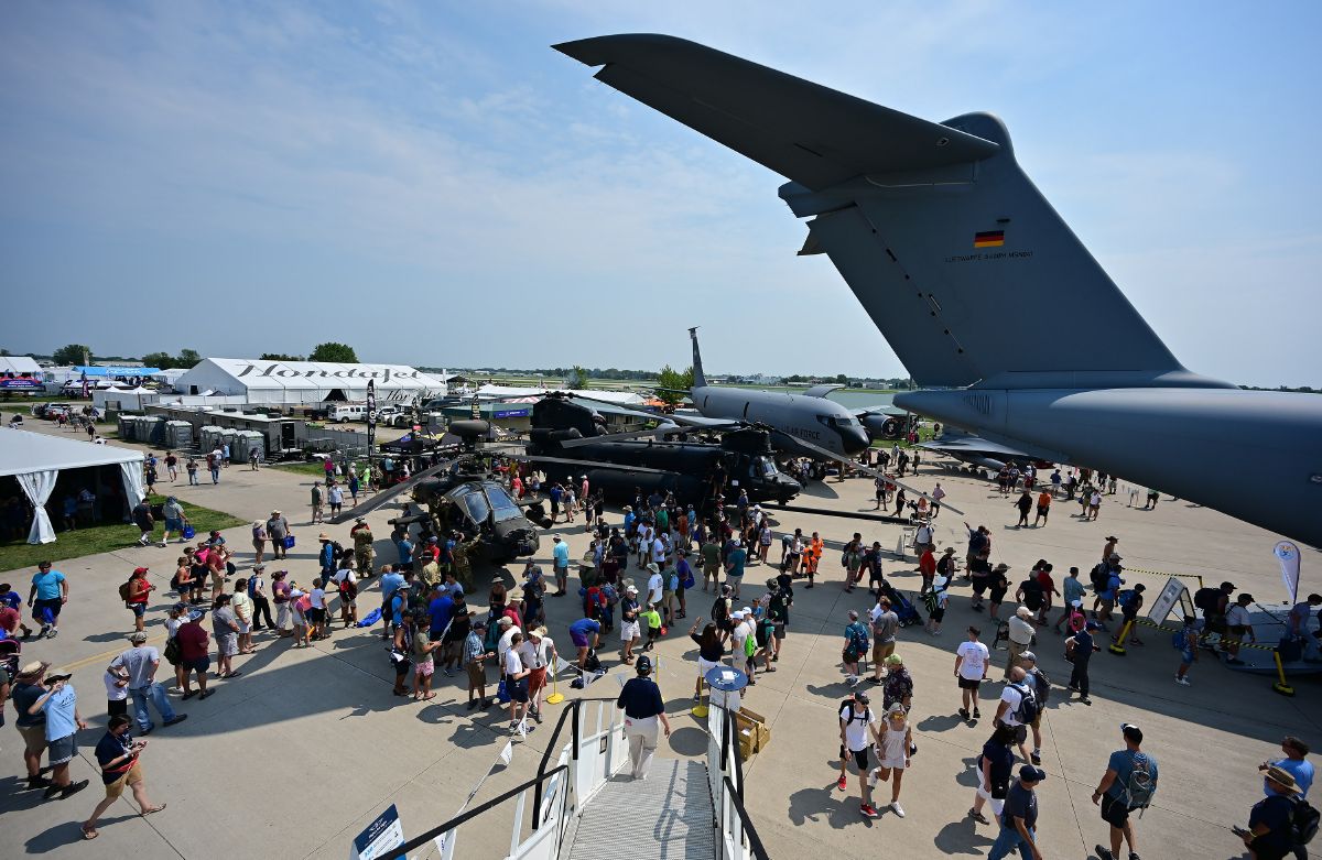 Airshow attendees crowd into Boeing Plaza during EAA AirVenture in Oshkosh, Wisconsin, Monday, July 26. Photo by David Tulis.