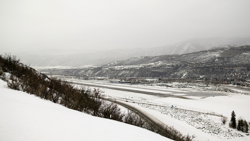 Cold temperature restricted airports like Colorado's Aspen Airport, shown here under IFR conditions, have altitude corrections that pilots need to make when flying an approach below certain temperatures.