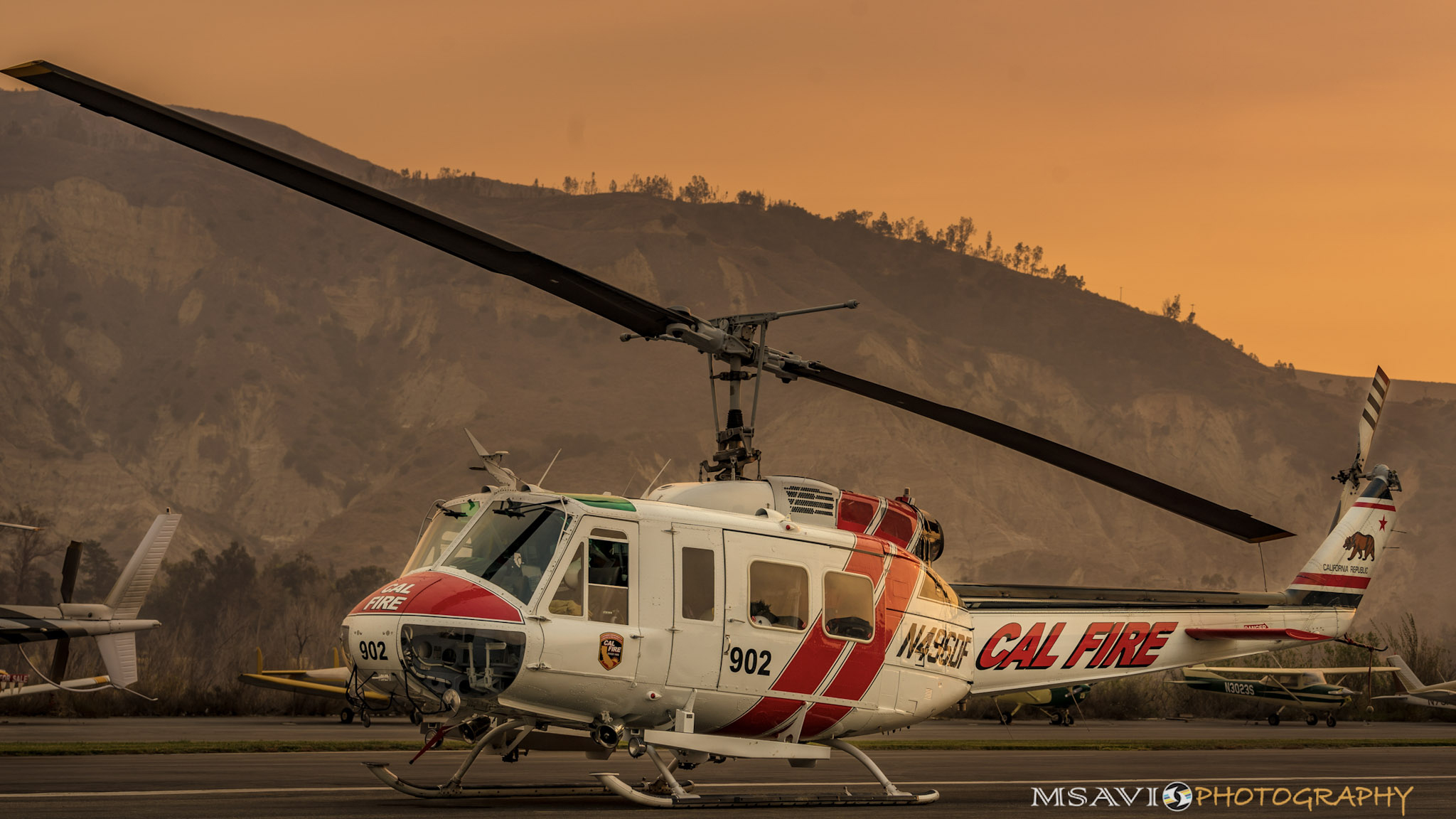 Smoke descends near a Cal Fire helicopter during firefighting operations based at California's Santa Paula Airport. Photo by Mike Salas, MSAVI Photography and Focal Flight.