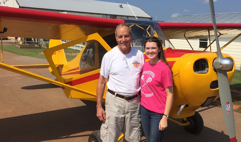 Student pilot Cayla McLeod is honoring her instructor and mentor Ron Alexander with aviation inspired wristbands that help celebrate his life. Photo courtesy of Cayla McLeod.