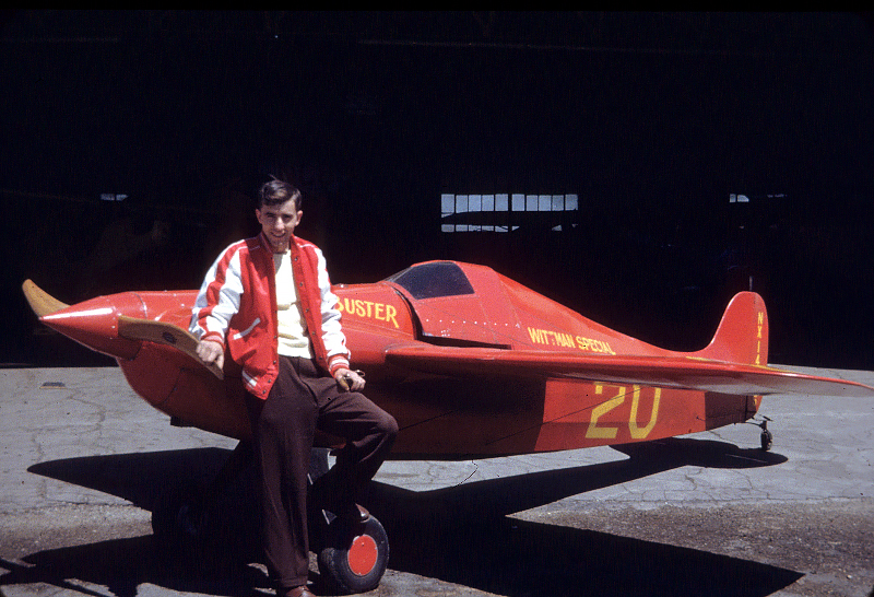 Pilot and Wisconsin aviation entrepreneur Bill Brennand stands by 'Buster' the air racer he flew to victory in the first race the young pilot ever entered in 1947. Photo courtesy of Jim Cunningham.