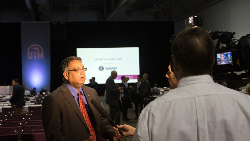 NASA UAS Traffic Management Program Principal Investigator Parimal Kopardekar is interviewed by local media at the UTM Convention in Syracuse, New York, in 2016. AOPA file photo. 