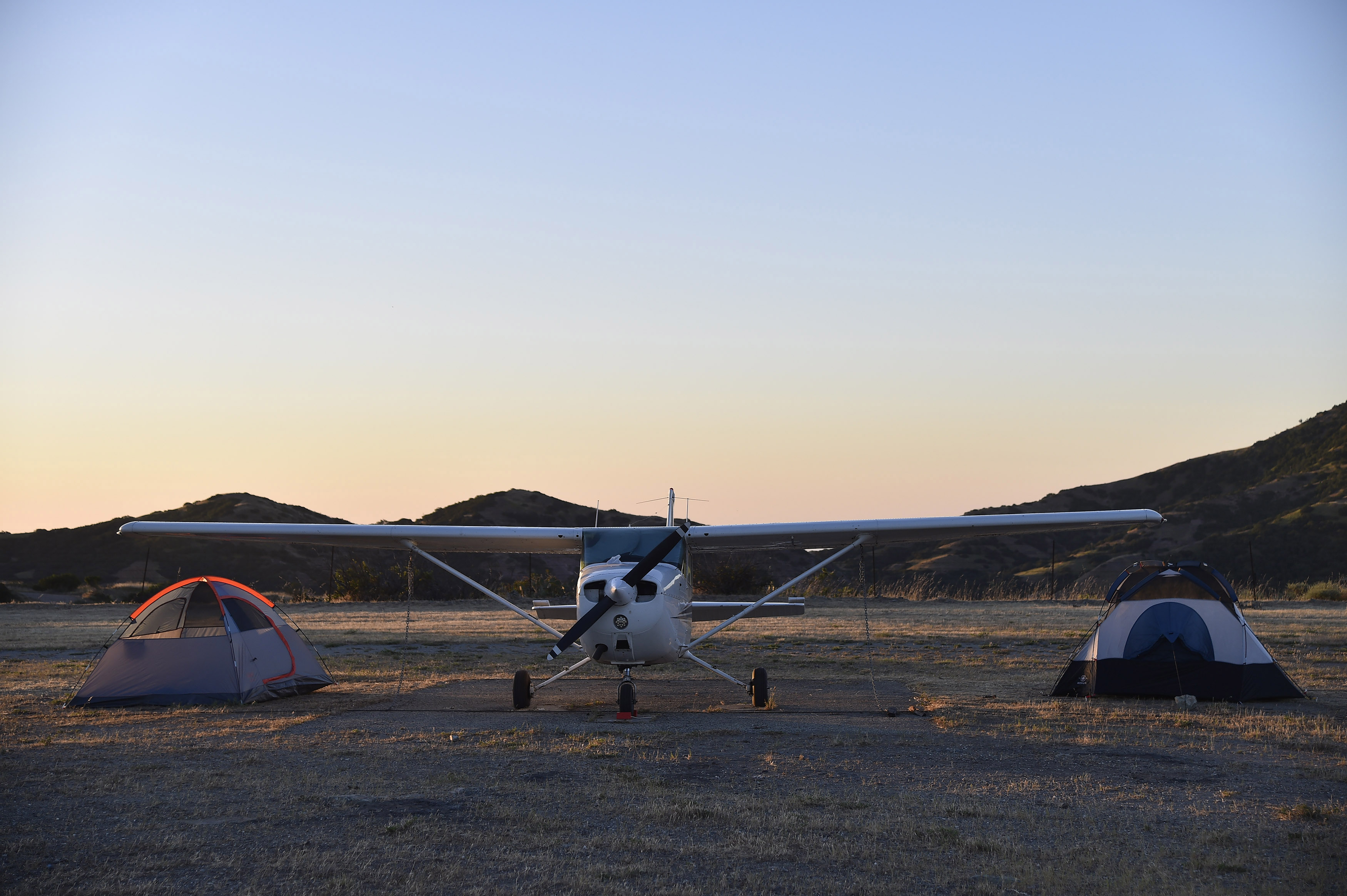 Brothers-in-law Albert Gersh and Steve Destler pitched a couple of tents next to their Cessna 172 on Catalina Island. Photo by David Tulis.