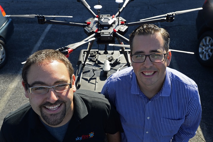 Matt Sloane (L) and Ben Kroll of SkyFire Consulting help teach drone concepts to fire department and rescue personnel March 20 in Frederick, Maryland. Photo by David Tulis.