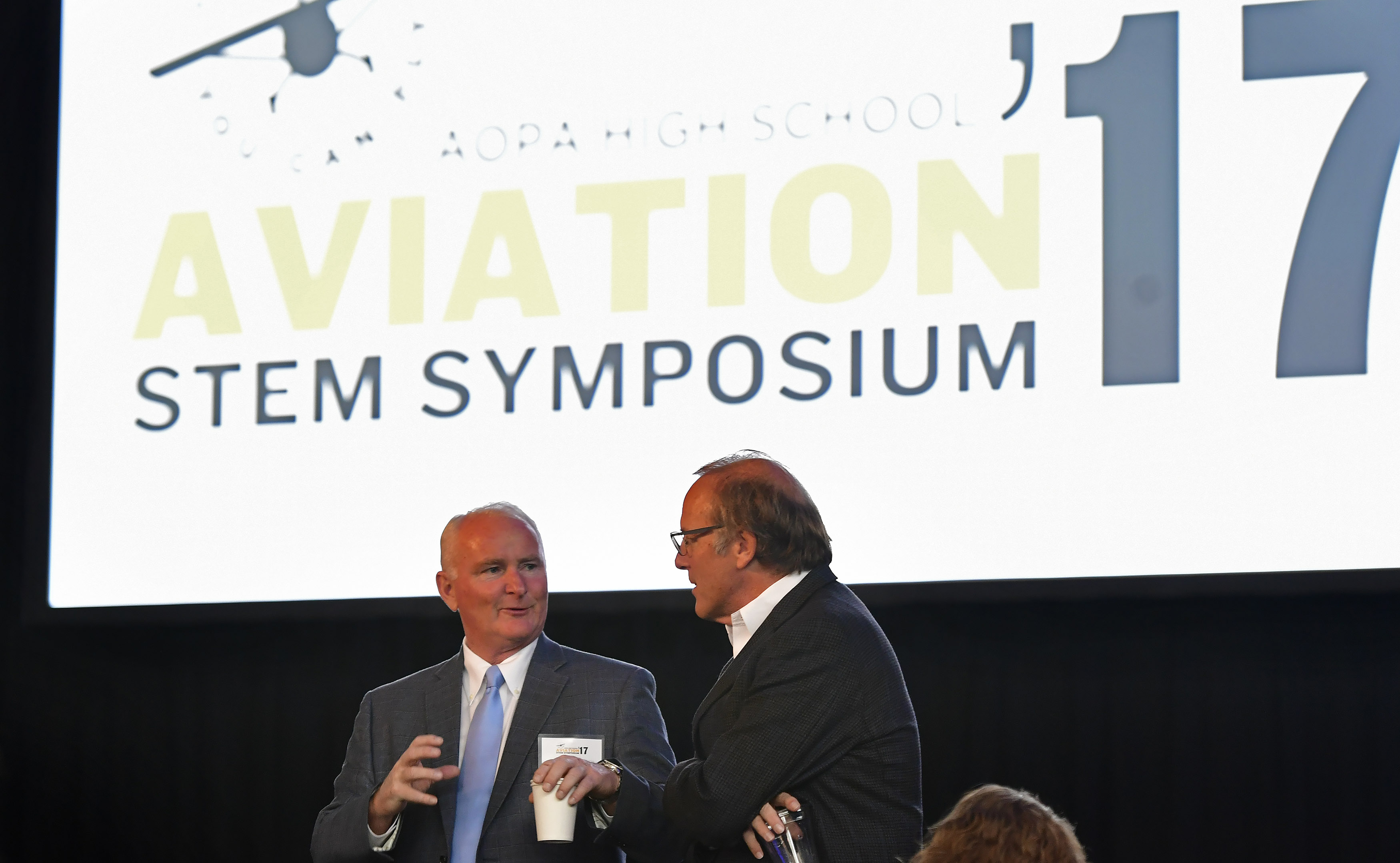 AOPA President and CEO Mark Baker chats with retired Alaska Air Group Chairman and CEO Bill Ayer during the AOPA High School Aviation STEM Symposium at American Airlines C.R. Smith Museum in Forth Worth, Texas, Nov. 6. Photo by David Tulis.