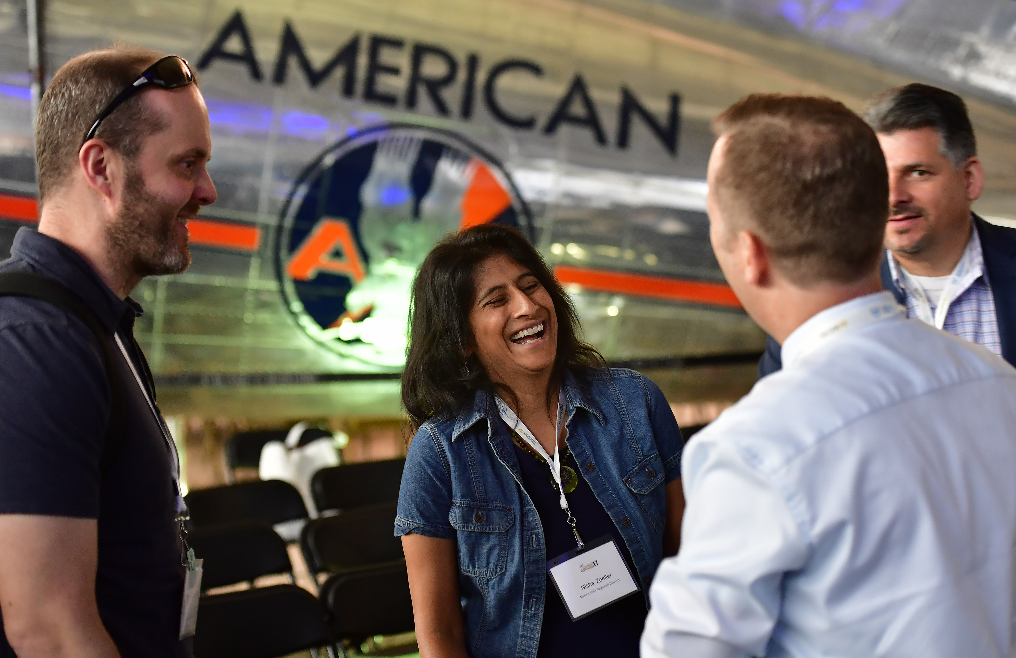Morris Hills Regional District Assistant Superintendent Nisha Zoeller, of New Jersey, greets friends during the AOPA High School Aviation STEM Symposium at American Airlines C.R. Smith Museum in Forth Worth, Texas, Nov. 6. Photo by David Tulis.