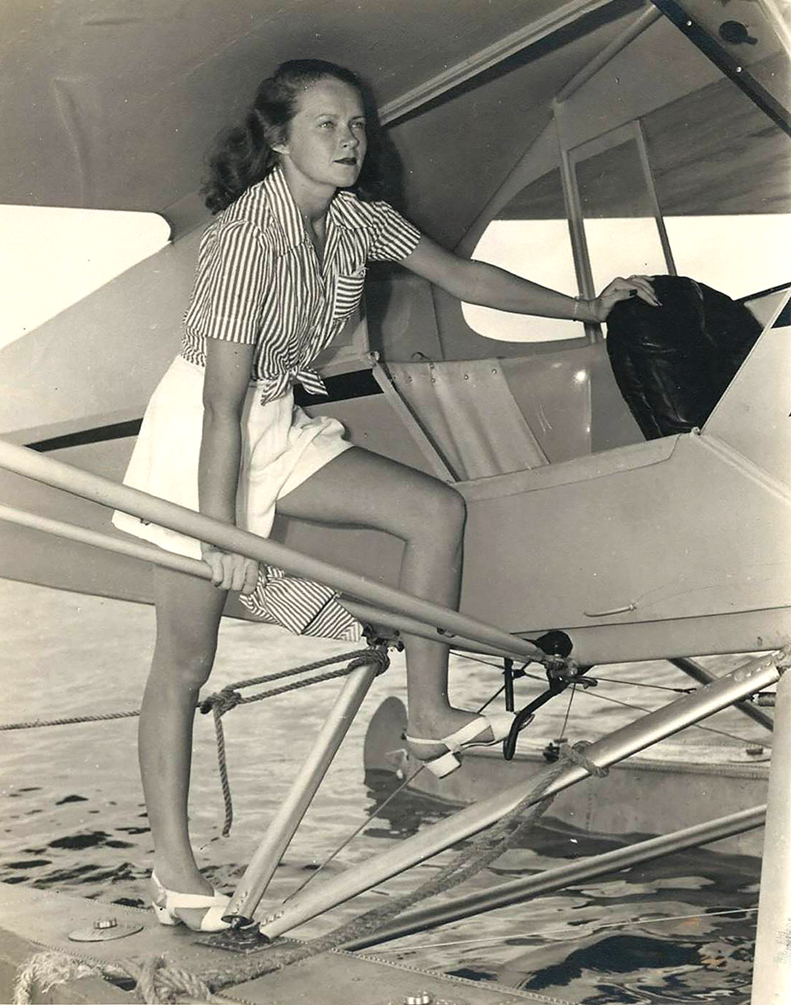 Embry-Riddle pilot Corinne Smith flew the same Piper Cub floatplane on the same day that John F. Kennedy took training in it during the spring of 1944 in Miami. Photo courtesy of Embry-Riddle Aeronautical University.
