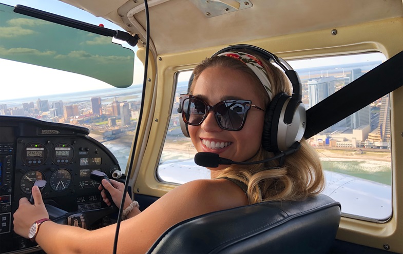 Atlantic City passes by the window as Miss New Jersey Jaime Gialloreto learns to fly a Piper Twin Comanche aircraft in preparation for Women in Aviation International's Girls in Aviation Day Oct. 13. Photo courtesy of Dave Krause, Influential Drones.