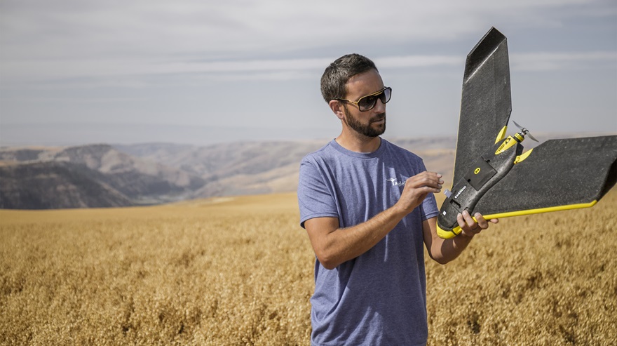 Robert Schoepflin inspects his eBee drone after a flight inspecting wildlife damage to a chickpea crop. AOPA file photo by Mike Fizer.