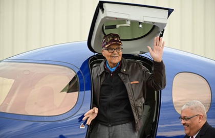 Retired U.S. Air Force Col. Charles McGee waves after landing a Cirrus SF50 Vision Jet with pilot Boni Caldeira at Frederick Municipal Airport during a 100th birthday celebration December 6. McGee will present an award named in his honor during the R. A. "Bob" Hoover Trophy Reception on March 18 in Washington, D.C. Photo by David Tulis.