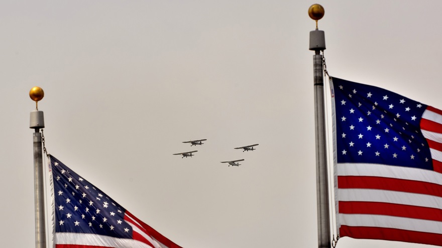 Four liasion aircraft fly in formation above the National Mall in Washington, D.C., during the Arsenal of Democracy: World War II Victory Capitol Flyover on May 8, 2015. A second Arsenal of Democracy Flyover is being planned for September 25, 2020. Photo by Mike Collins.