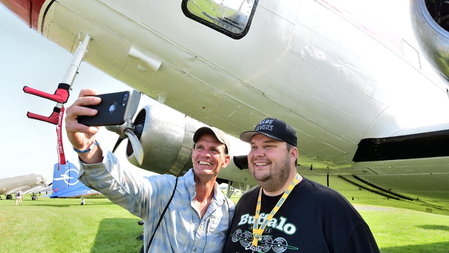 A Plane Savers enthusiast takes a selfie with Mikey McBryan, who conceived the project, at EAA AirVenture 2019. Photo by Mike Collins.