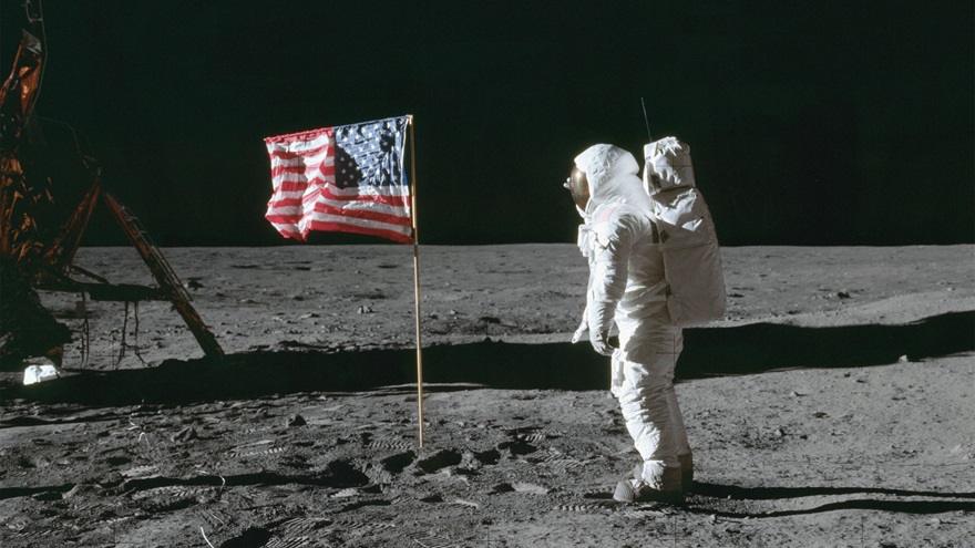 Astronaut Edwin E. Aldrin, Lunar Module (LM) pilot, poses for a photo beside the U.S. flag that has been placed on the moon. Image taken at Tranquility Base during the Apollo 11 Mission. Photo courtesy of NASA.