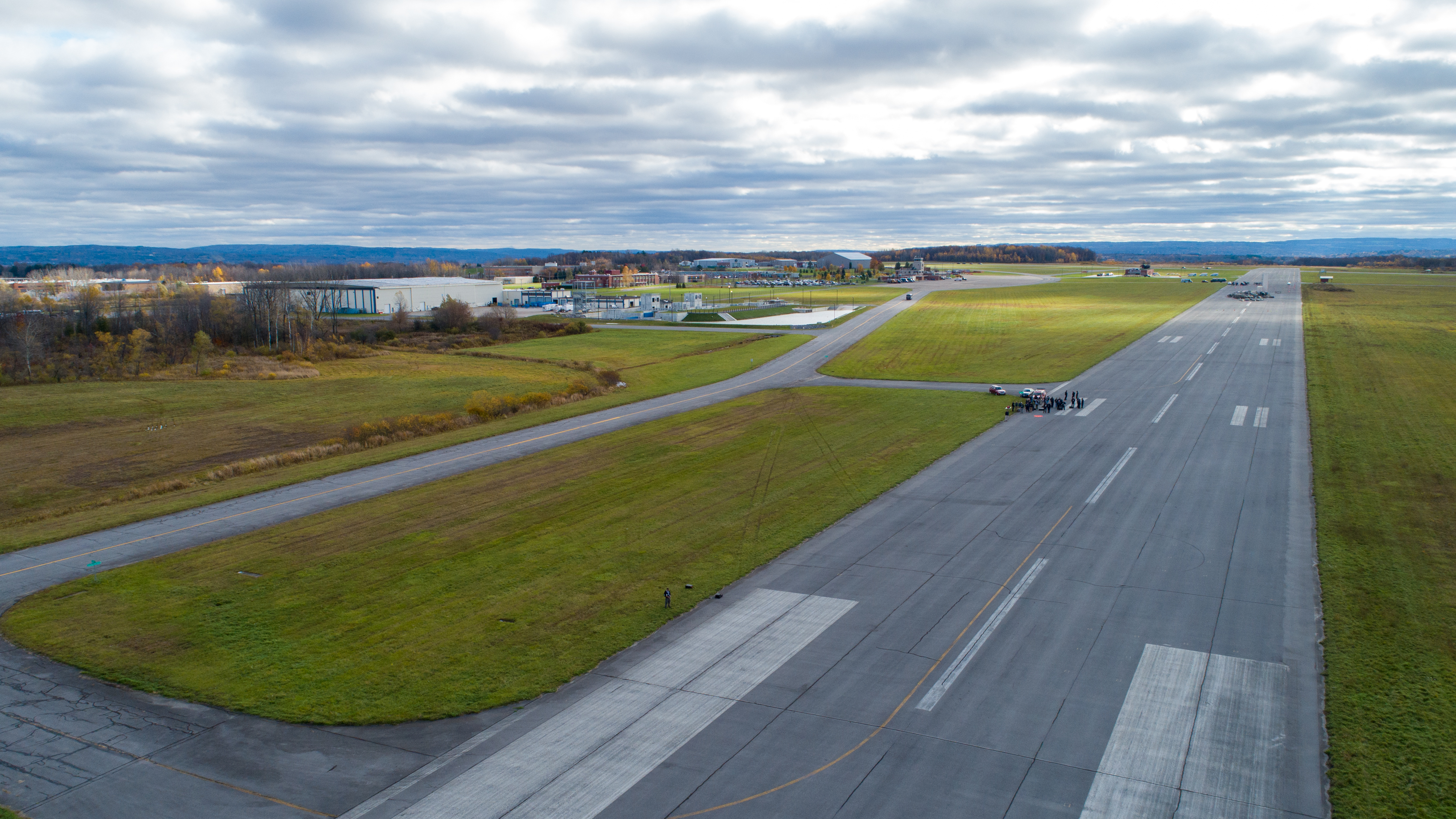 The former Oneida County Airport has been repurposed into the New York State Preparedness Training Center, where groups of firefighters and police rotated through four hands-on training scenario stations on October 29. One of these, a rubble pilot, sits at the center of the decommissioned runway in the background. Jim Moore photo.