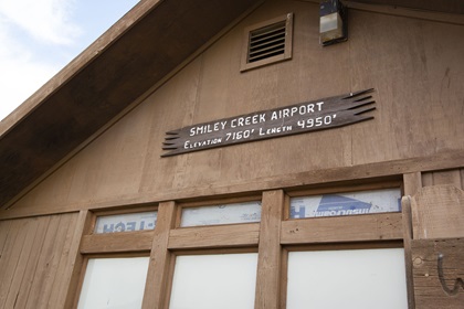 A handcrafted sign welcomes visitors to the Smiley Creek Airport in Idaho. Photo by Tyler Pangborn.