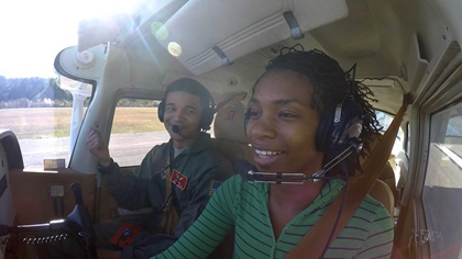 Red Tail Scholarship Foundation participants Torius Moore and Emilia Tolbert taxi a Cessna at Moton Field Municipal Airport. Photo by Josh Cochran.                                                         