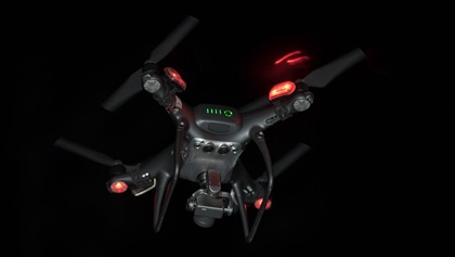 A DJI Phantom 4 Pro Obsidian Edition is flown at night (with LED strobe lights attached to enhance visibility as required by FAA waiver). Photo by Jim Moore.