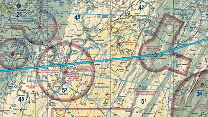 The details of the sectional chart show rather inhospitable terrain if ceilings prevent VFR pilots from putting enough altitude between themselves and mountain peaks. Under marginal VFR conditions, a long detour to cross the mountains where their elevation is lower is clearly the better option. Photo by Chris Eads.