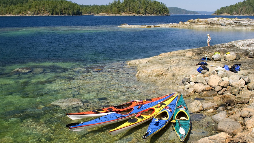 British Columbia is for sea kayakers, with its fair share of sunshine in the summer. Photo courtesy of Powell River Sea Kayak Ltd.