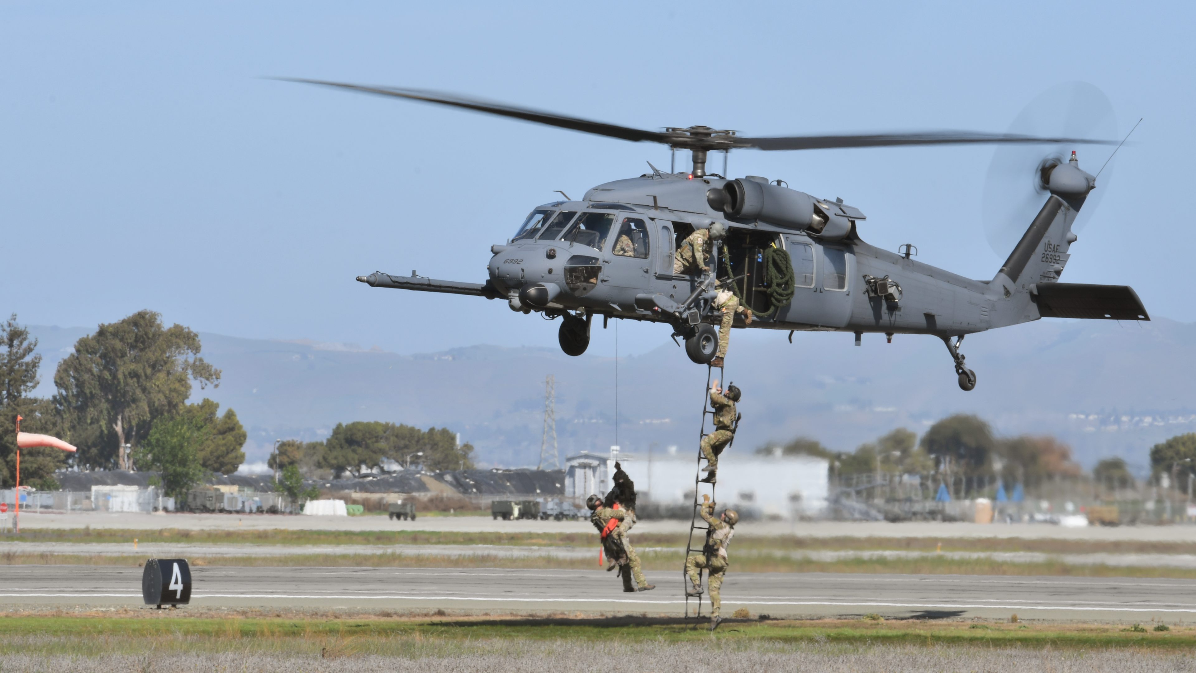 Members of the California Air National Guard's 129th Rescue Wing, based at Moffett Federal Airfield in Mountain View, California, conduct a rescue demonstration February 29 during the GoFly Prize Final Fly Off airshow. Photo by Mike Collins.