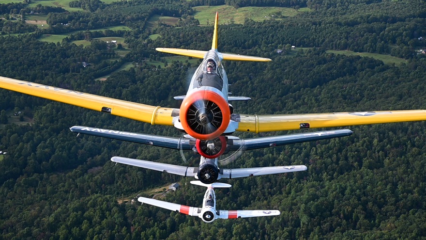 Veterans Airlift Command CEO Walt Fricke leads a four-ship North American T-6 Texan warbird formation flight over northern Virginia during preparation for the Arsenal of Democracy flyover of Washington, D.C. Nearly 70 World War II aircraft and their pilots will recognize the seventy-fifth anniversary of Victory in Europe Day during a celebration that was rescheduled from May because of the coronavirus pandemic. Photo by David Tulis.