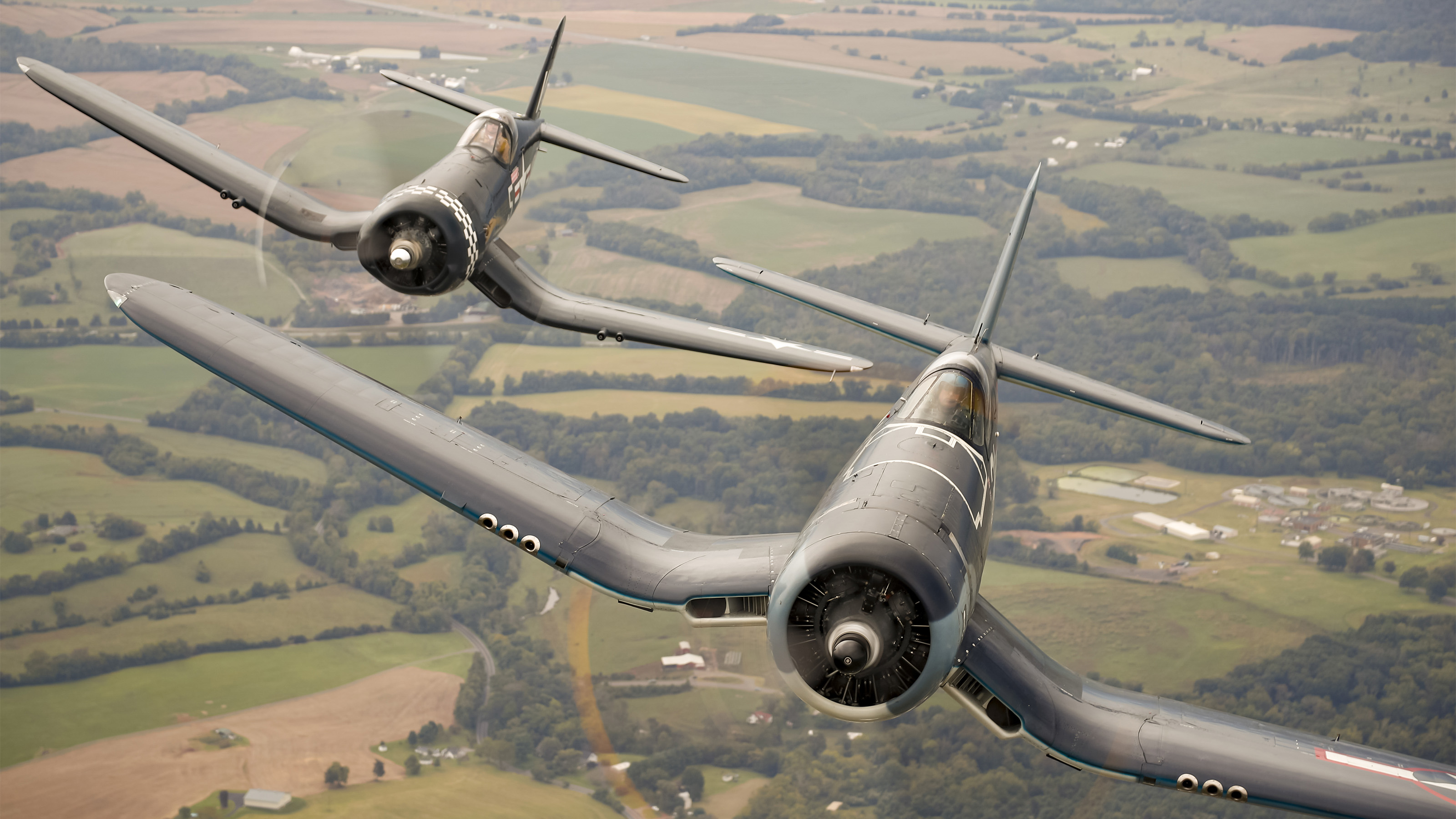 The flyover features a variety of aircraft such as Vought F4U Corsairs. Photo by Chris Rose.