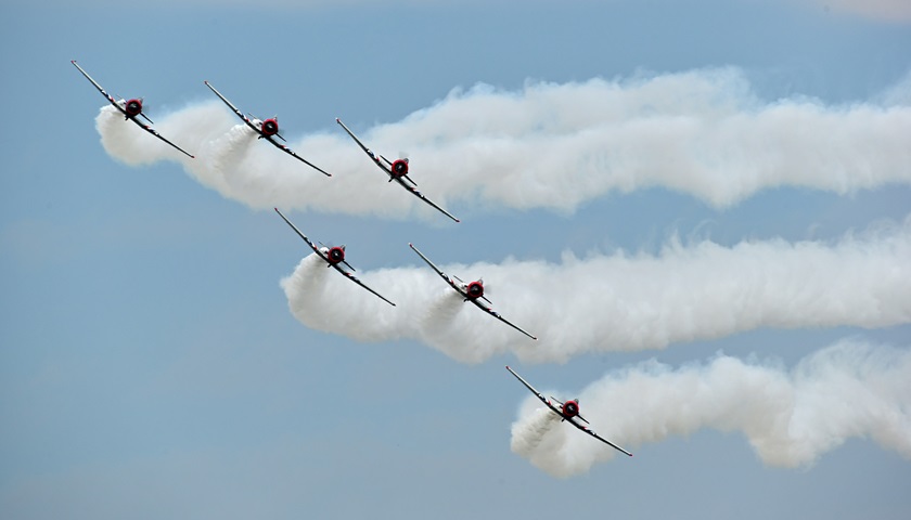 The Geico Skytypers Air Show Team performs during EAA AirVenture. Photo by David Tulis.