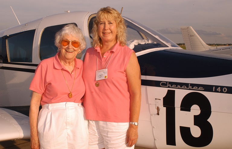 Elaine Roehrig, left, poses for a photo with Air Race Classic partner Marolyn Wilson near the No. 13 Piper Cherokee in 2004. Roehrig, a CFI with more than 15,000 hours, died August 22. Photo courtesy of Marolyn Wilson.