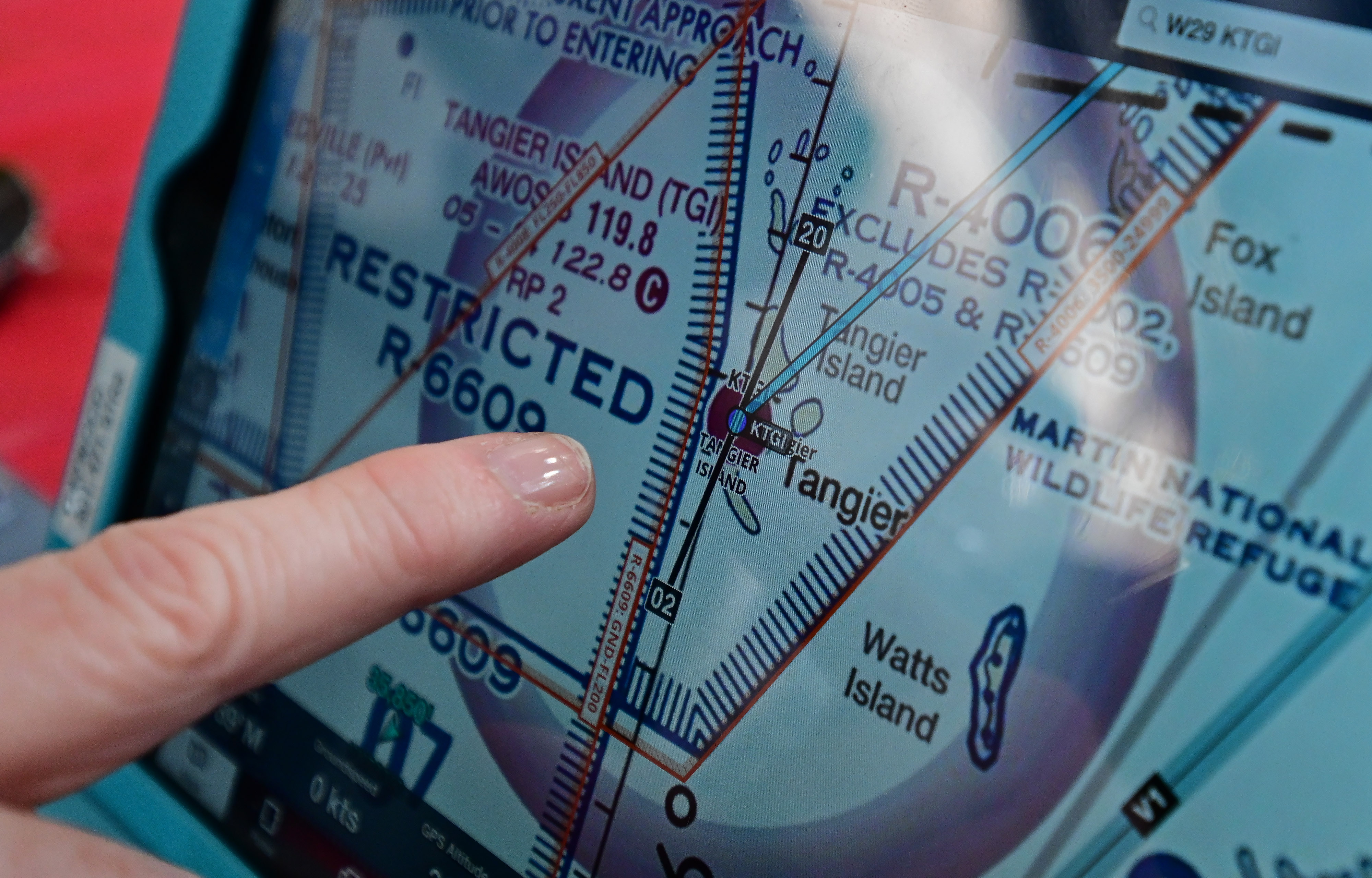Certified flight instructor-instruments Lin Caywood evaluates the restricted airspace surrounding Tangier Island, Virginia, in the Chesapeake Bay. Photo by David Tulis.                                                                                                                       