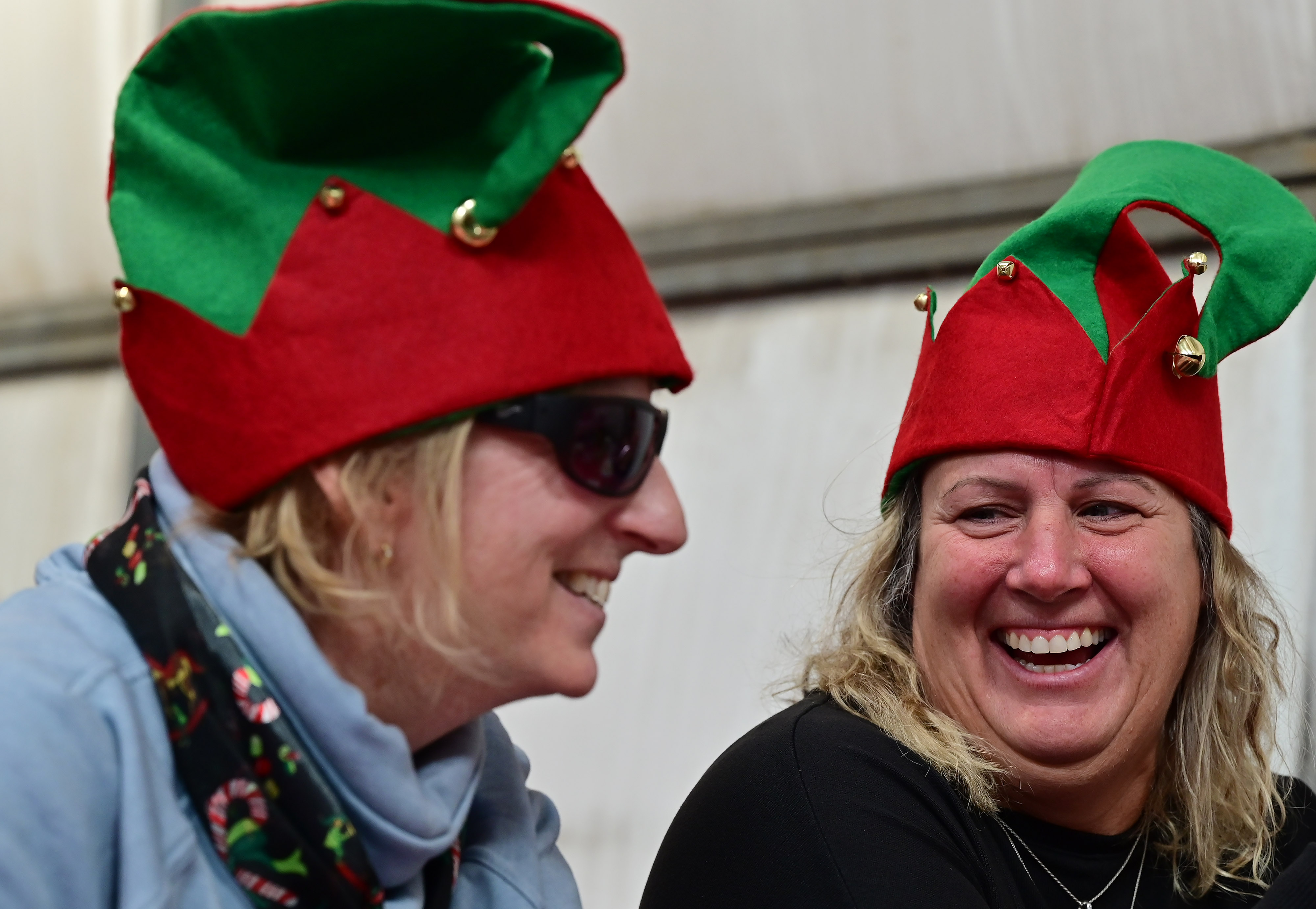 Certified flight instructor-instruments Lin Caywood and student Tina Richardson wear festive hats during a breakfast for pilots at Bay Bridge Airport in Stevensville, Maryland. Photo by David Tulis.                                                                                                     