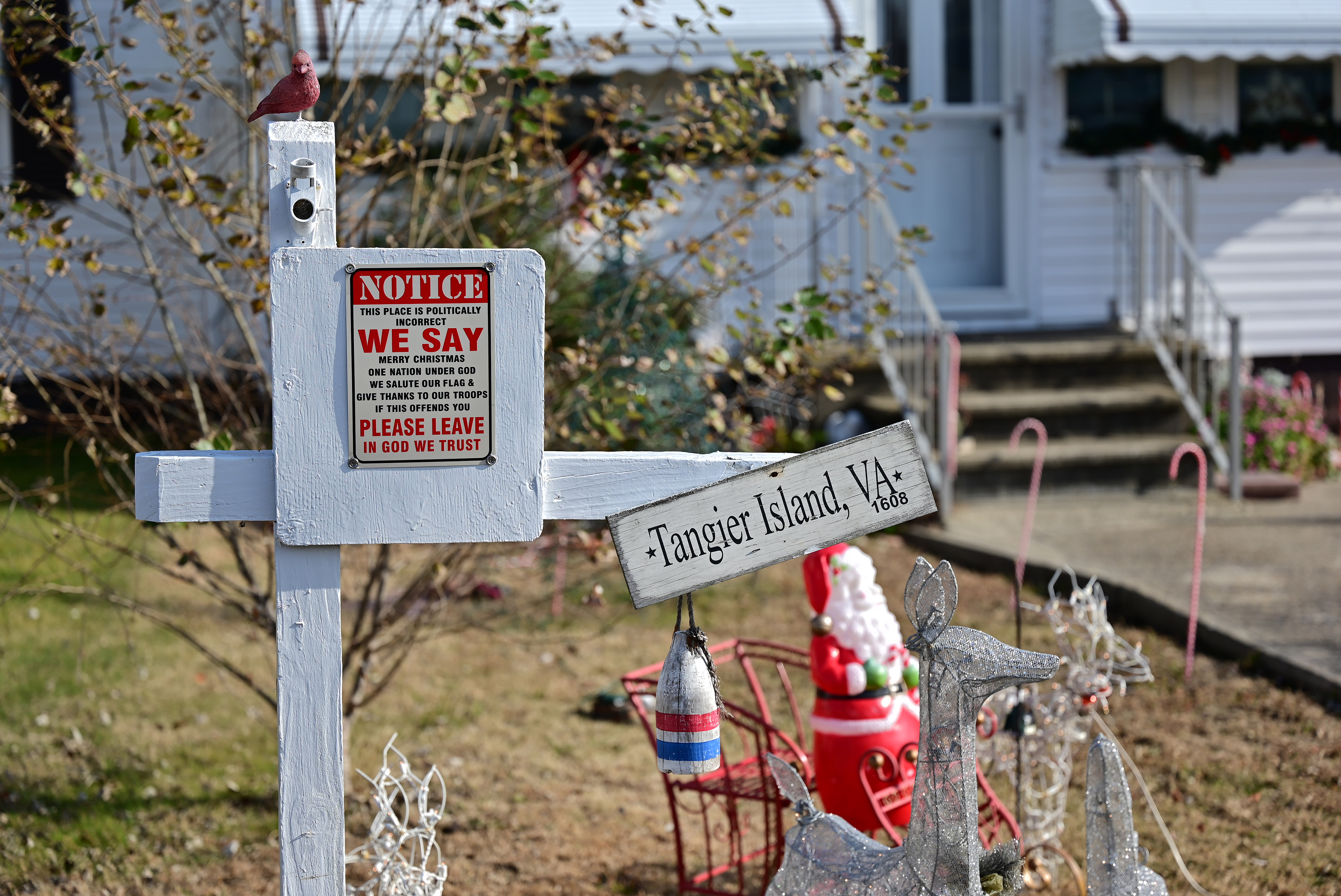 A resident’s house on Tangier Island, Virginia, in the Chesapeake Bay is decorated with a small Santa Claus for the holidays. The island’s 400 residents remain vocal in their beliefs. Photo by David Tulis.                                                                              