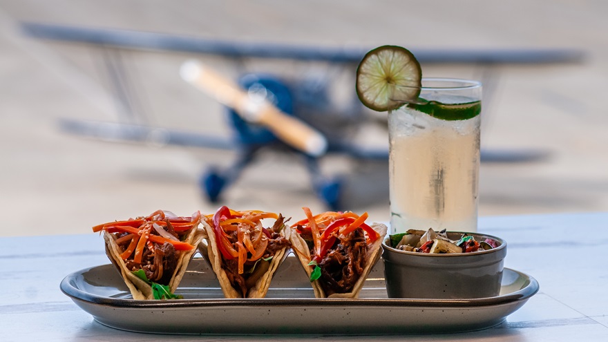 The signature Waco Taco from Waco Kitchen is assembled at the factory restaurant with crispy chicken on corn tortillas served with "marinated red and napa cabbage, vibrant mango jalapeno salsa, silk chili drizzle and lime zest crema." Photo courtesy of Waco Aircraft Corp. 